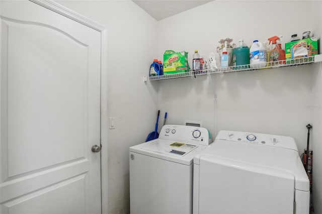 laundry room with independent washer and dryer