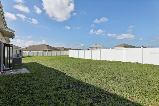 view of yard featuring central AC