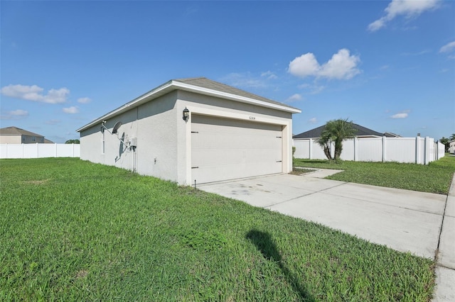 garage with a lawn