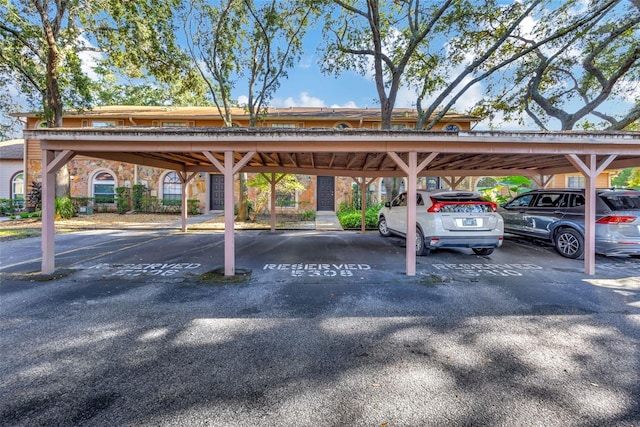 view of vehicle parking with a carport