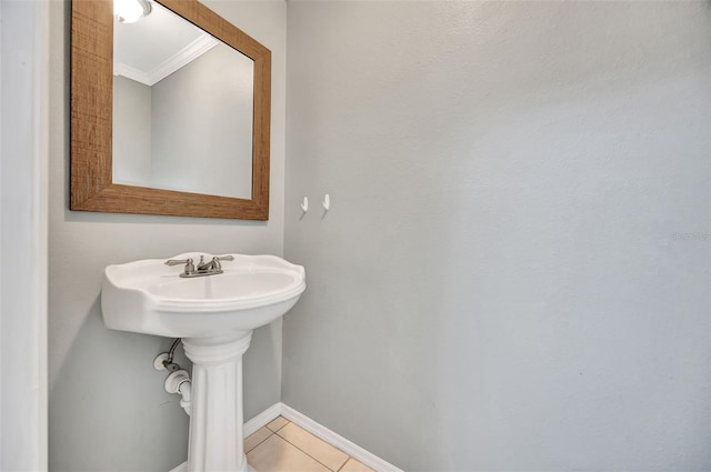 bathroom with ornamental molding and tile patterned floors