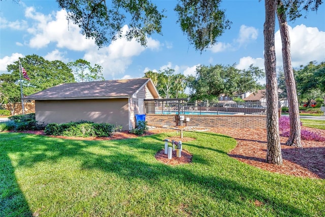 view of yard featuring a fenced in pool