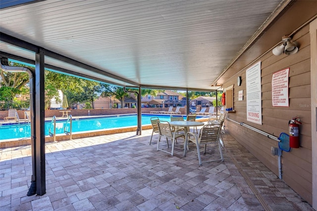 view of swimming pool with a patio area