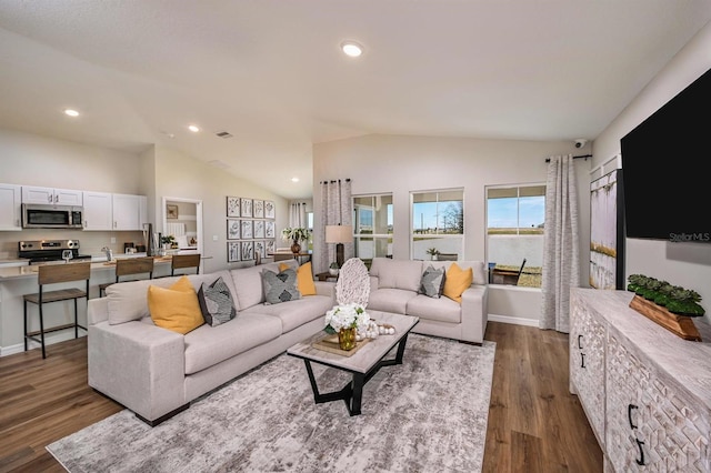 living room with lofted ceiling and dark hardwood / wood-style flooring