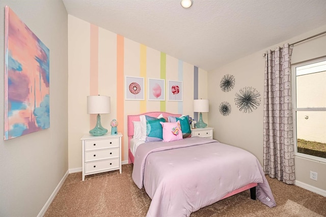 carpeted bedroom with a textured ceiling and vaulted ceiling