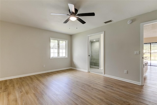 spare room with light hardwood / wood-style floors and ceiling fan