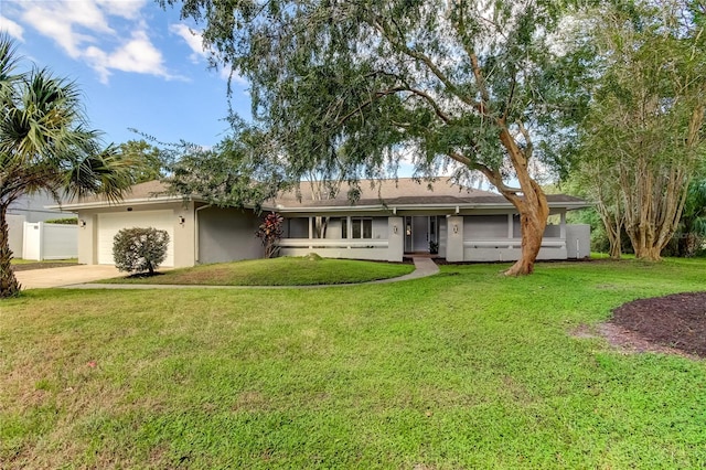 exterior space with a front lawn and a garage