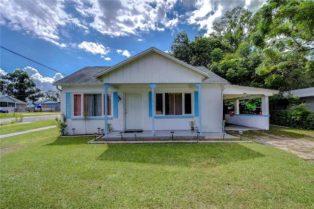 bungalow-style house featuring a front lawn and a porch