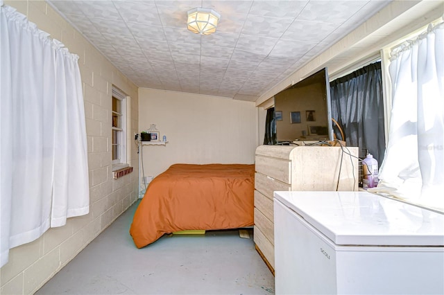 bedroom featuring white fridge