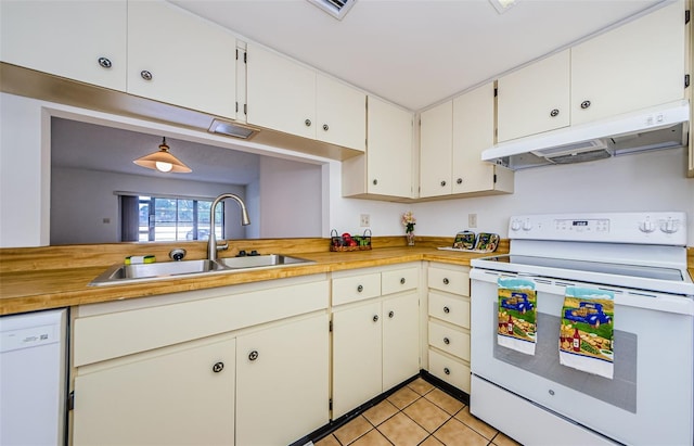 kitchen featuring light tile patterned flooring, sink, white appliances, white cabinetry, and wood counters