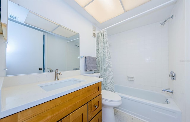 full bathroom featuring tile patterned flooring, vanity, toilet, and shower / bath combo with shower curtain