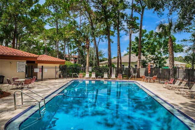 view of swimming pool featuring a patio area