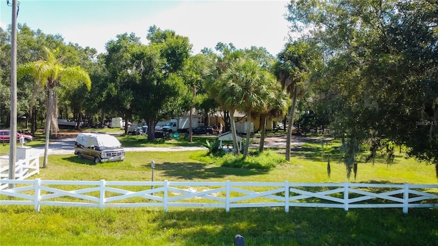 view of property's community with a lawn