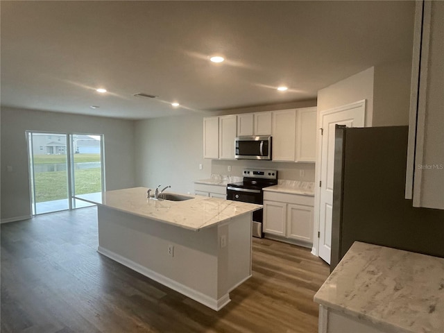 kitchen featuring white cabinetry, stainless steel appliances, a center island with sink, and sink