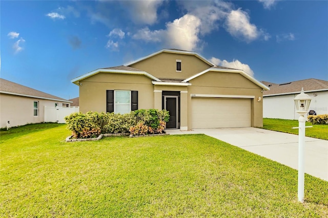 single story home featuring a garage and a front lawn