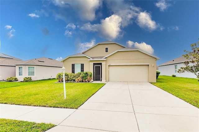 ranch-style house featuring a front yard and a garage