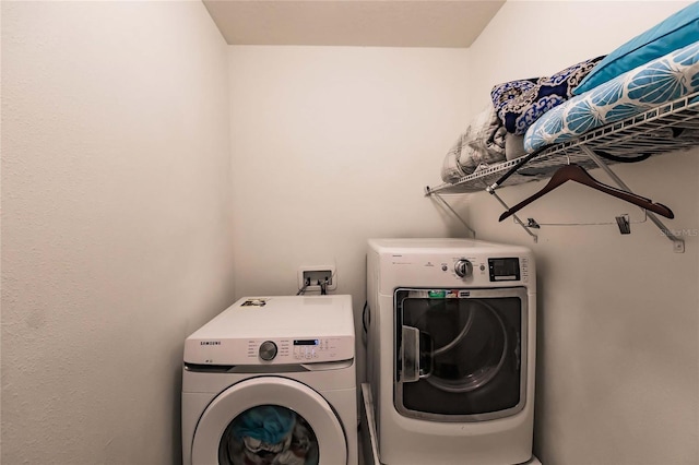 laundry area with separate washer and dryer