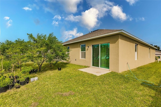 rear view of property with a yard