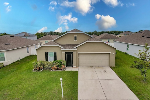 view of front of home featuring a garage and a front lawn