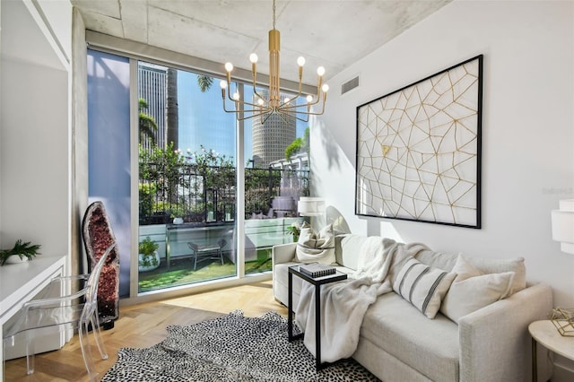 living area with a chandelier and parquet floors