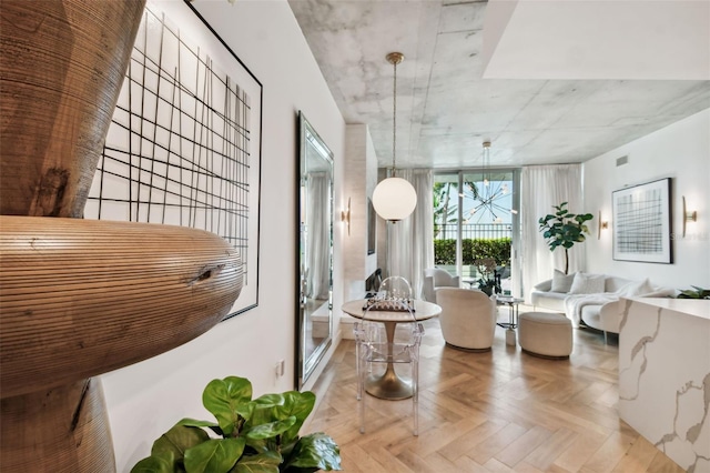 interior space featuring an inviting chandelier and light parquet floors