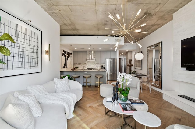 living room with an inviting chandelier and light parquet floors