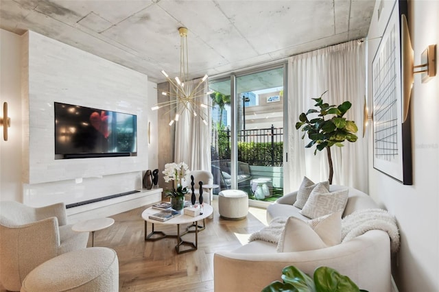 living room with parquet floors, floor to ceiling windows, and a chandelier