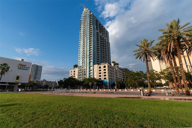 view of property's community with a lawn