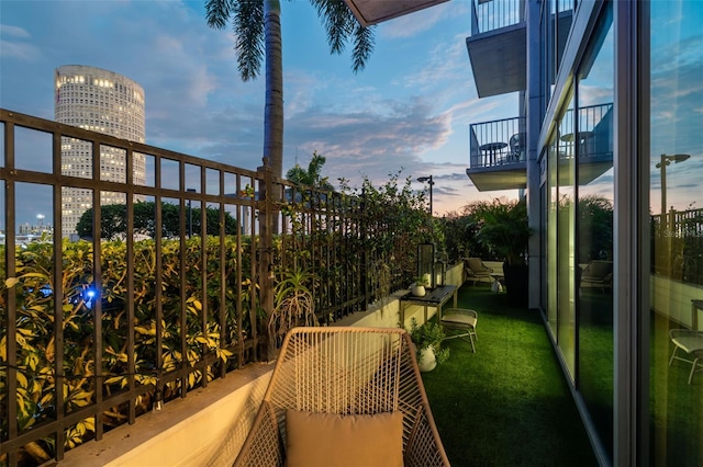 view of balcony at dusk