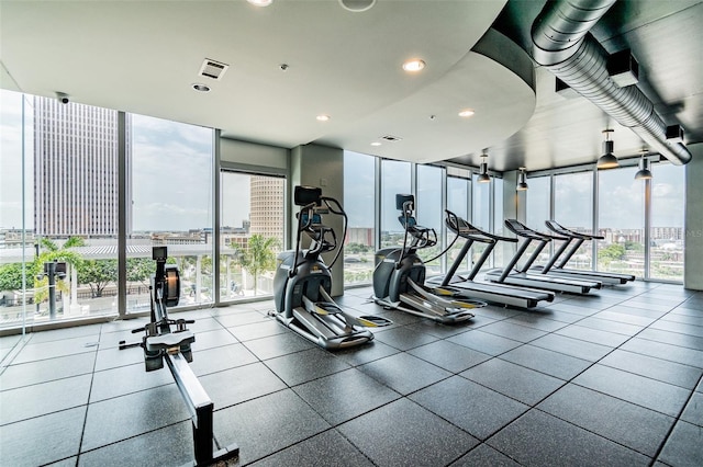 exercise room with floor to ceiling windows