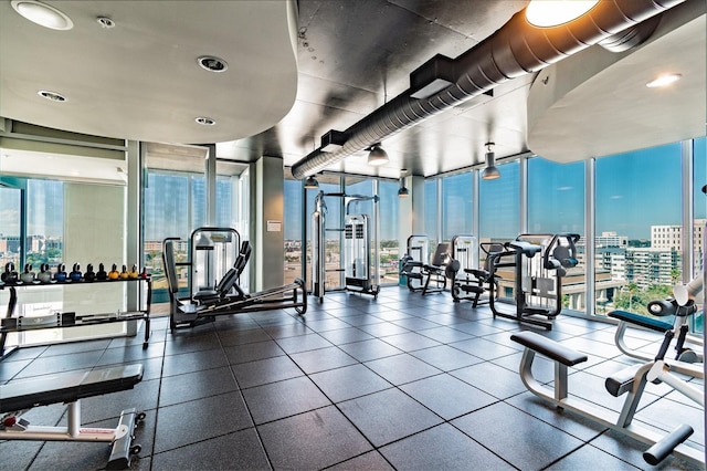 exercise room with floor to ceiling windows