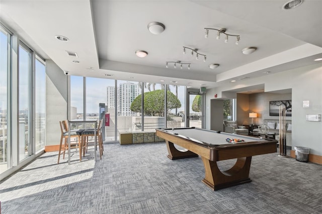 rec room with carpet flooring, a tray ceiling, and billiards