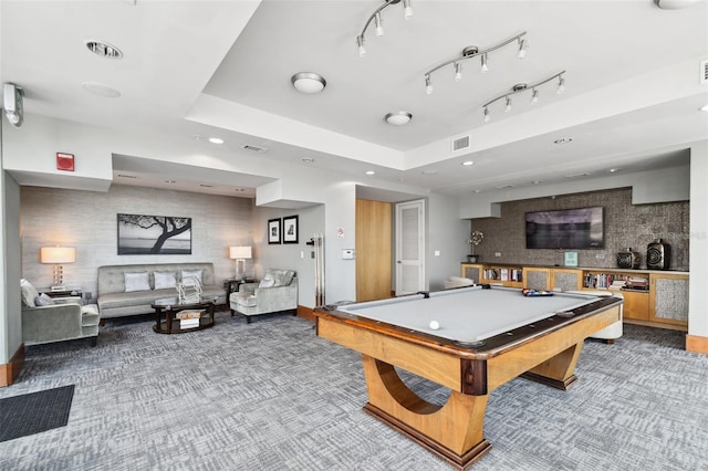 game room with pool table and a tray ceiling