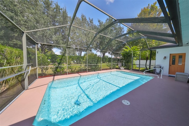 view of pool with a lanai and a patio area