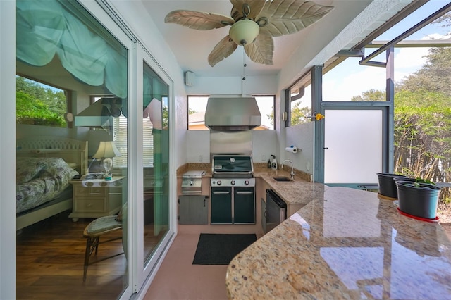 sunroom featuring sink and ceiling fan