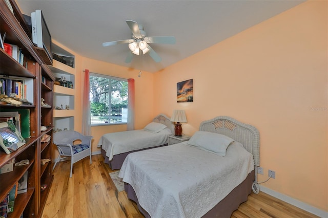 bedroom featuring light hardwood / wood-style flooring and ceiling fan