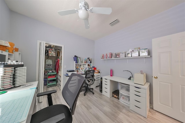 office space with light wood-type flooring and ceiling fan