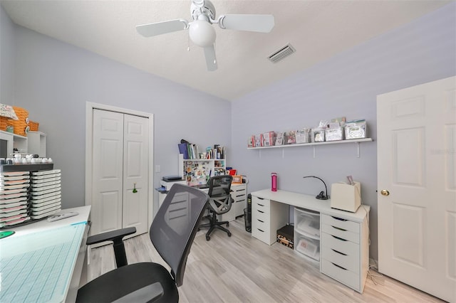 office featuring light hardwood / wood-style floors and ceiling fan