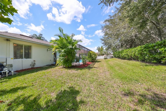 view of yard featuring a lanai