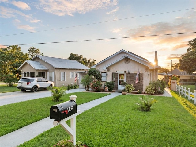 view of front of home with a lawn