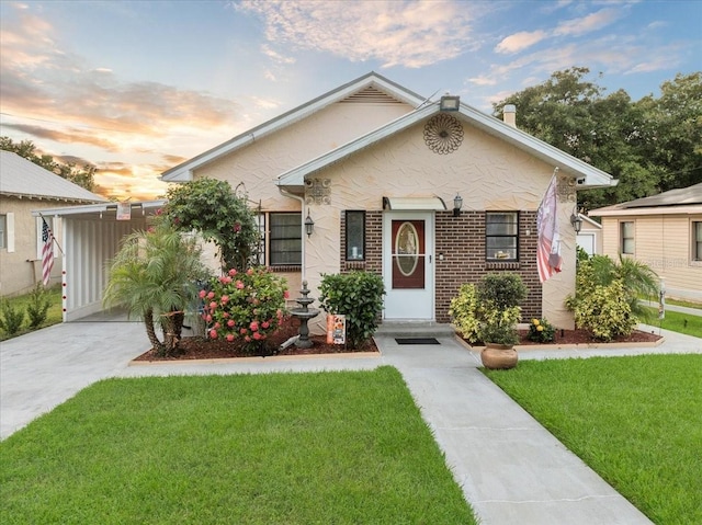 view of front of house with a yard