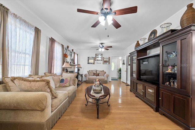 living room featuring light wood-type flooring and ceiling fan