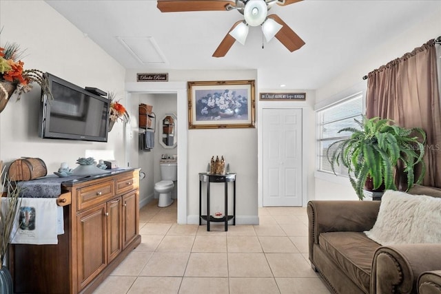 living room featuring ceiling fan and light tile patterned floors