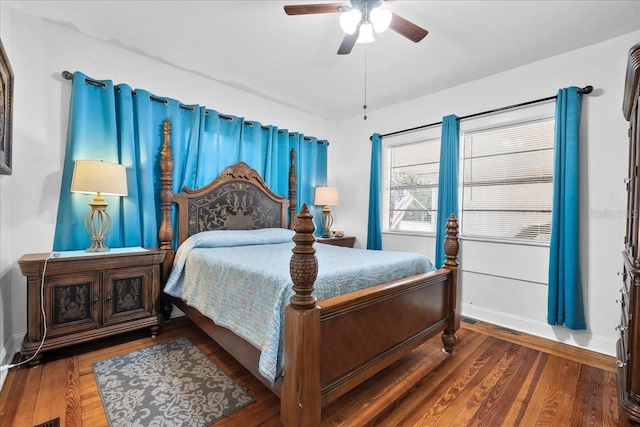 bedroom featuring ceiling fan and dark wood-type flooring