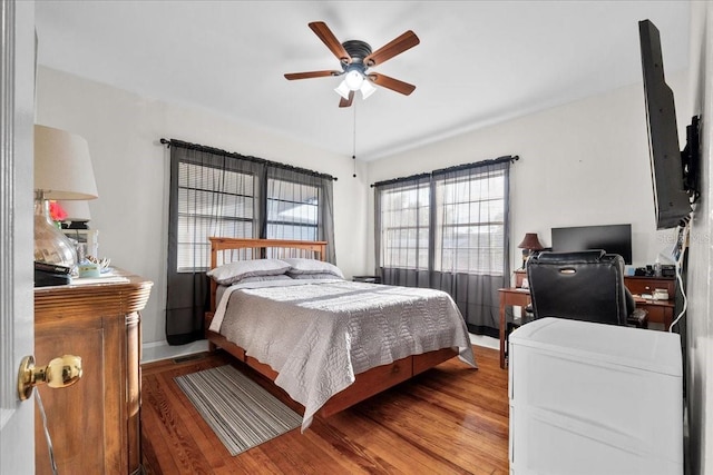 bedroom with wood-type flooring and ceiling fan