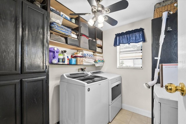 laundry room with light tile patterned floors, ceiling fan, washer and dryer, and cabinets