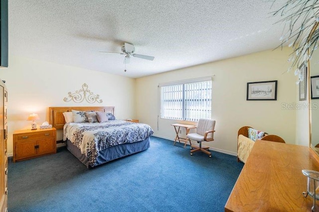 carpeted bedroom with a textured ceiling and ceiling fan