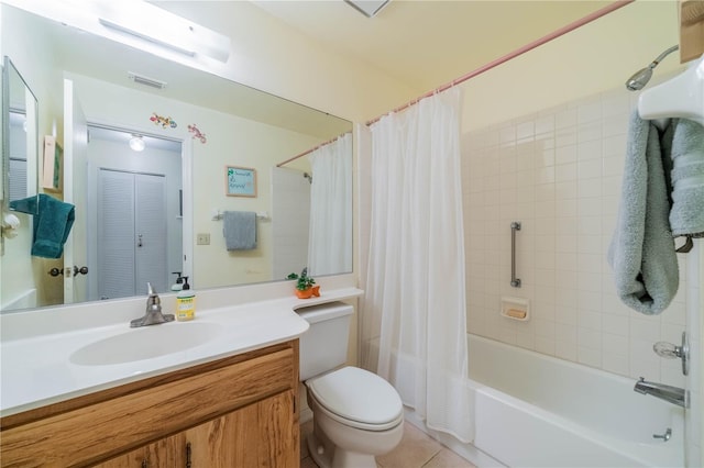 full bathroom with shower / tub combo with curtain, tile patterned floors, vanity, and toilet