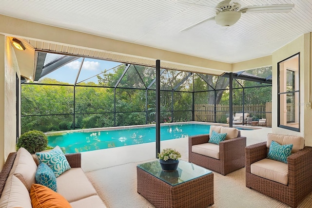 view of pool featuring a lanai, an outdoor hangout area, ceiling fan, and a patio area