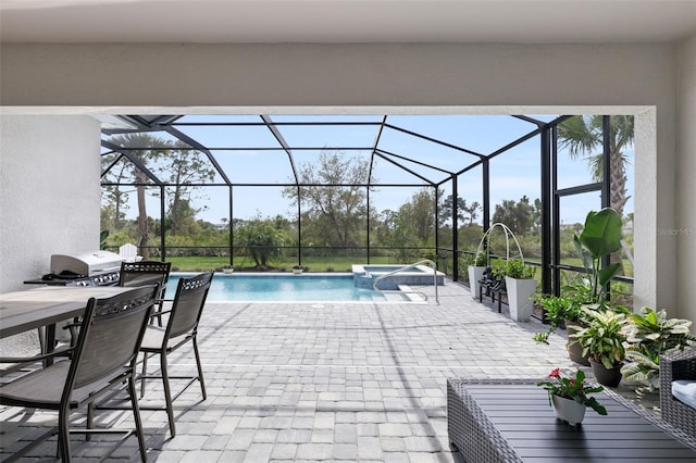 view of swimming pool featuring glass enclosure and a patio area